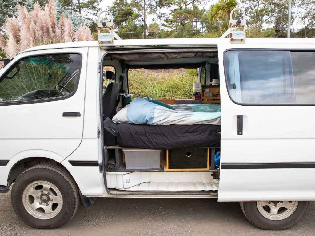 Side view of camper van setup: storage